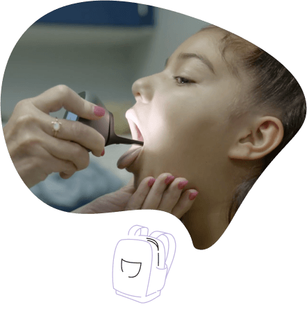 child doing throat exam with tytocare device