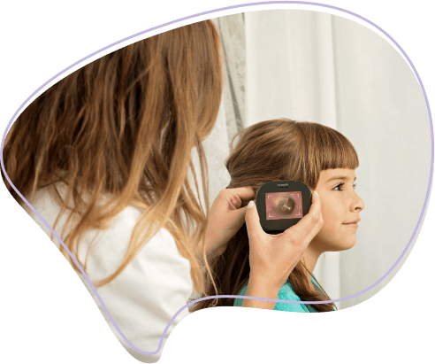 Parent using Tyto for ear exam on daughter